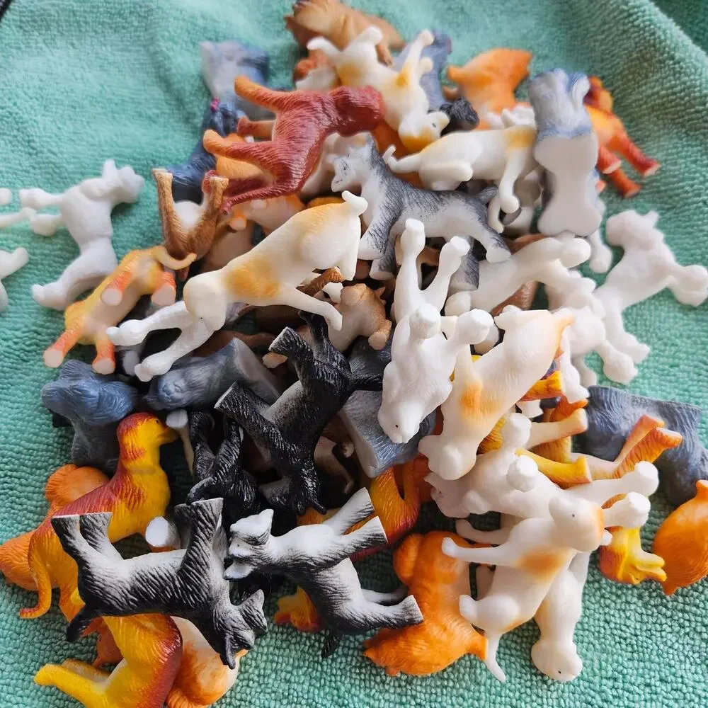 61 multi colored plastic dog figurines